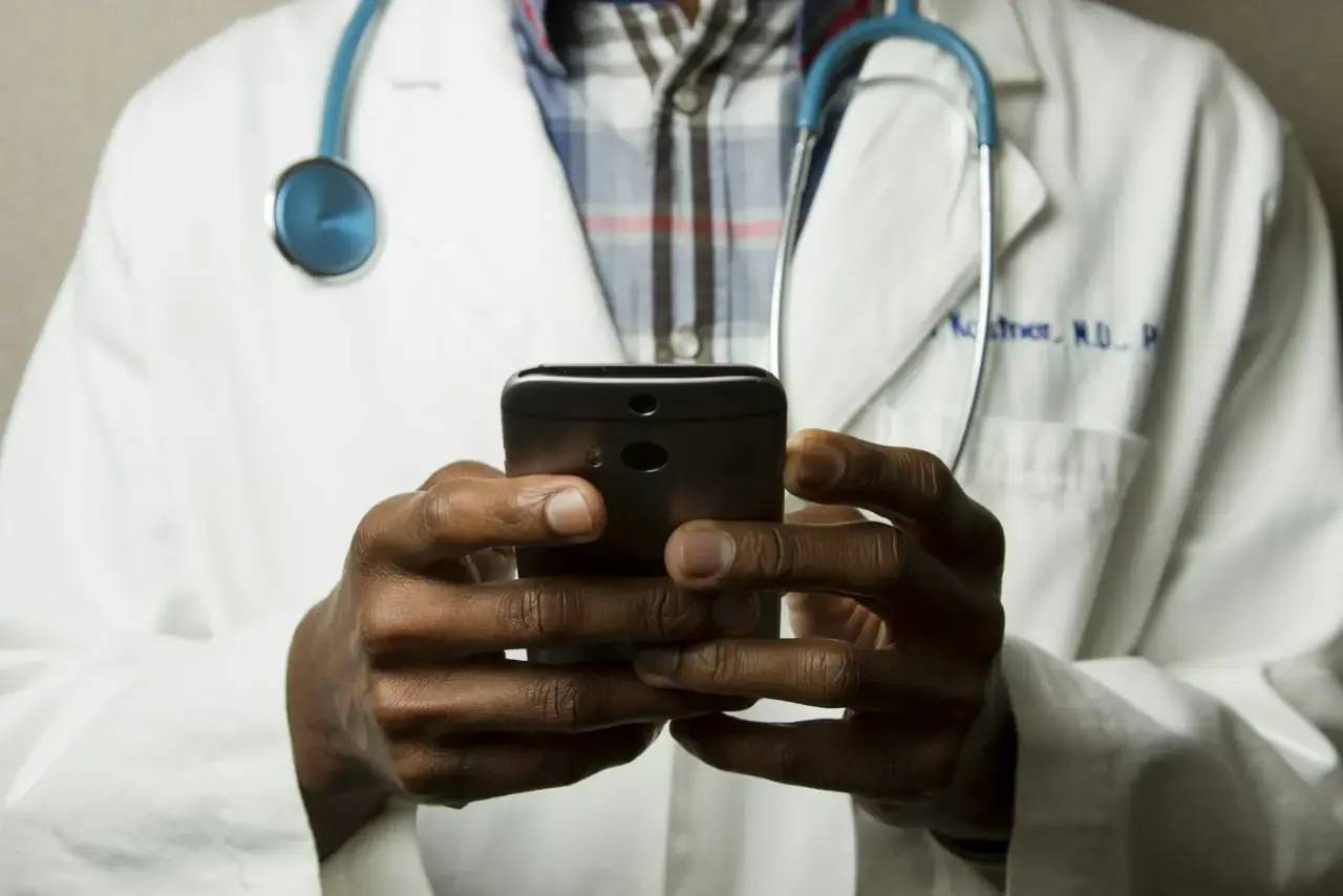 Doctor reviewing social media content for compliance with NMC advertising guidelines
